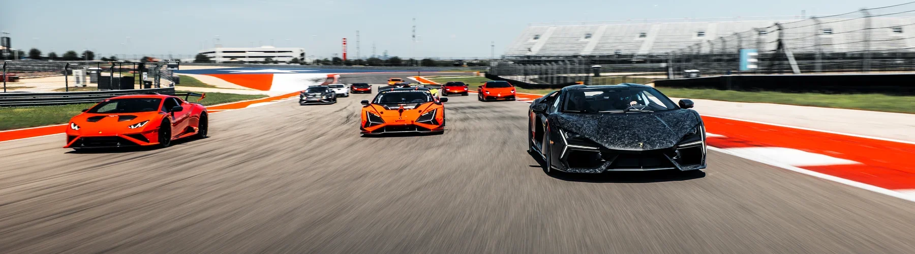 Lamborghini supercars driving on a racetrack